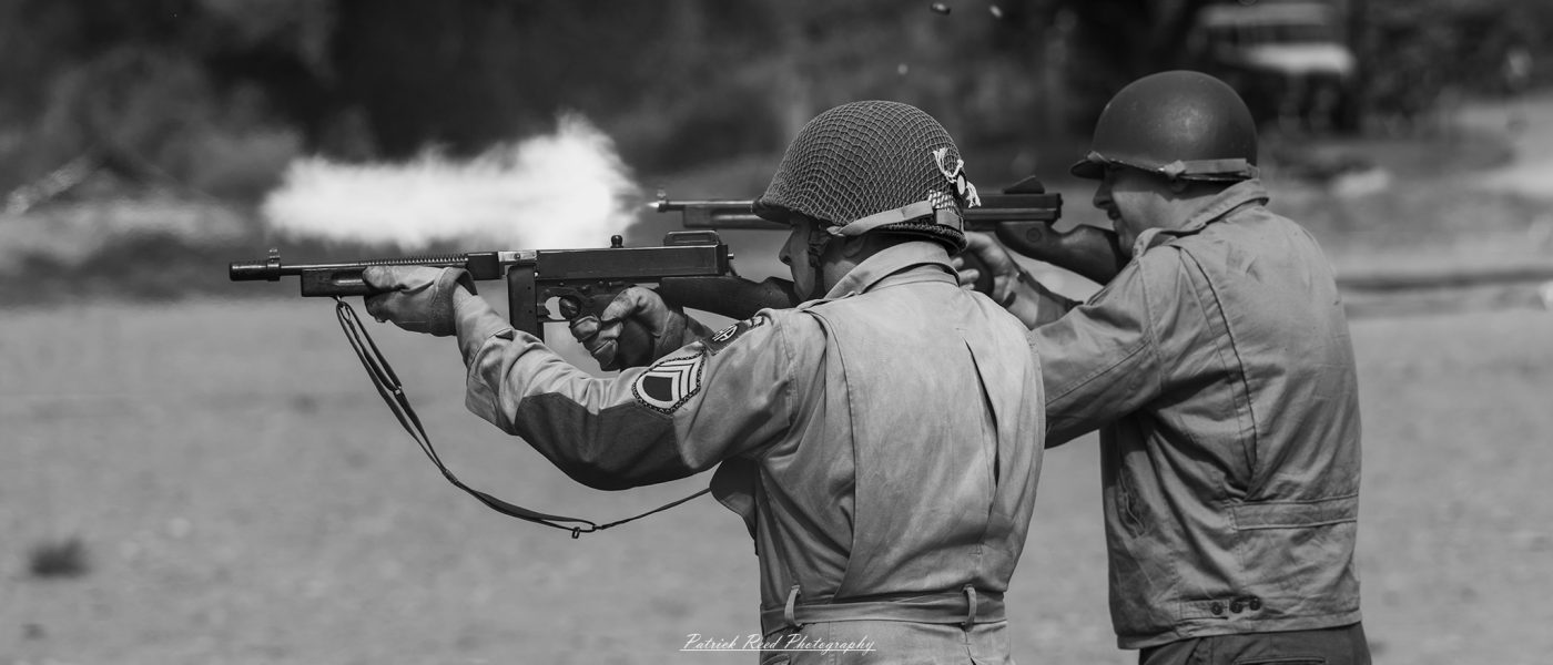 "An action-packed scene of a soldier firing a Thompson submachine gun, the weapon's rapid-fire capability evident in the blur of the recoil. The soldier is focused and composed, emphasizing the Thompson's effectiveness in close-range combat."